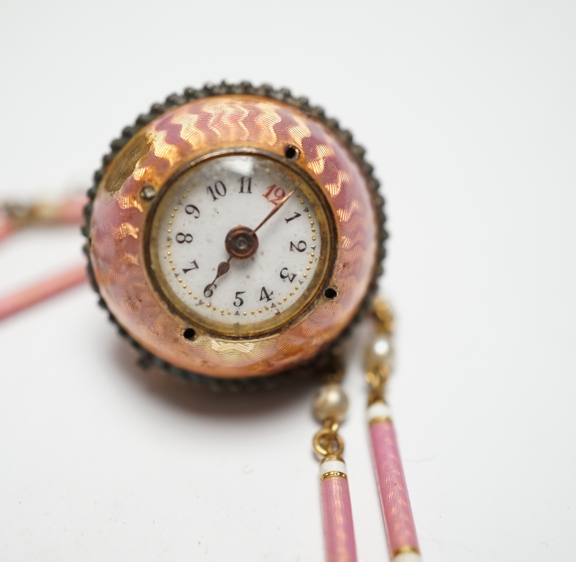 A lady's Swiss Belle Epoque yellow metal, rose cut diamond and enamelled globe watch, on a similar yellow metal rose cut diamond, two colour enamel and seed pearl set necklace, overall 84cm (a.f.).